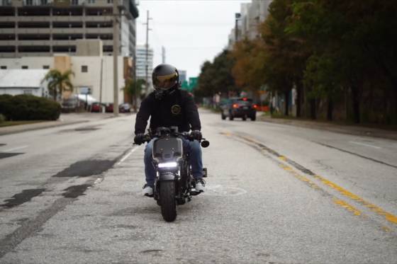 New rider confidently riding a Honda Ruckus 150cc for the first time.