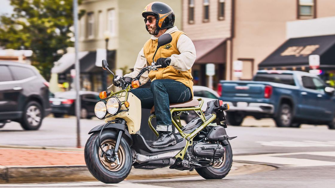 A rider riding honda ruckus