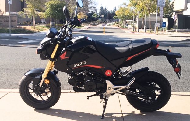 2015 honda grom black on a road side